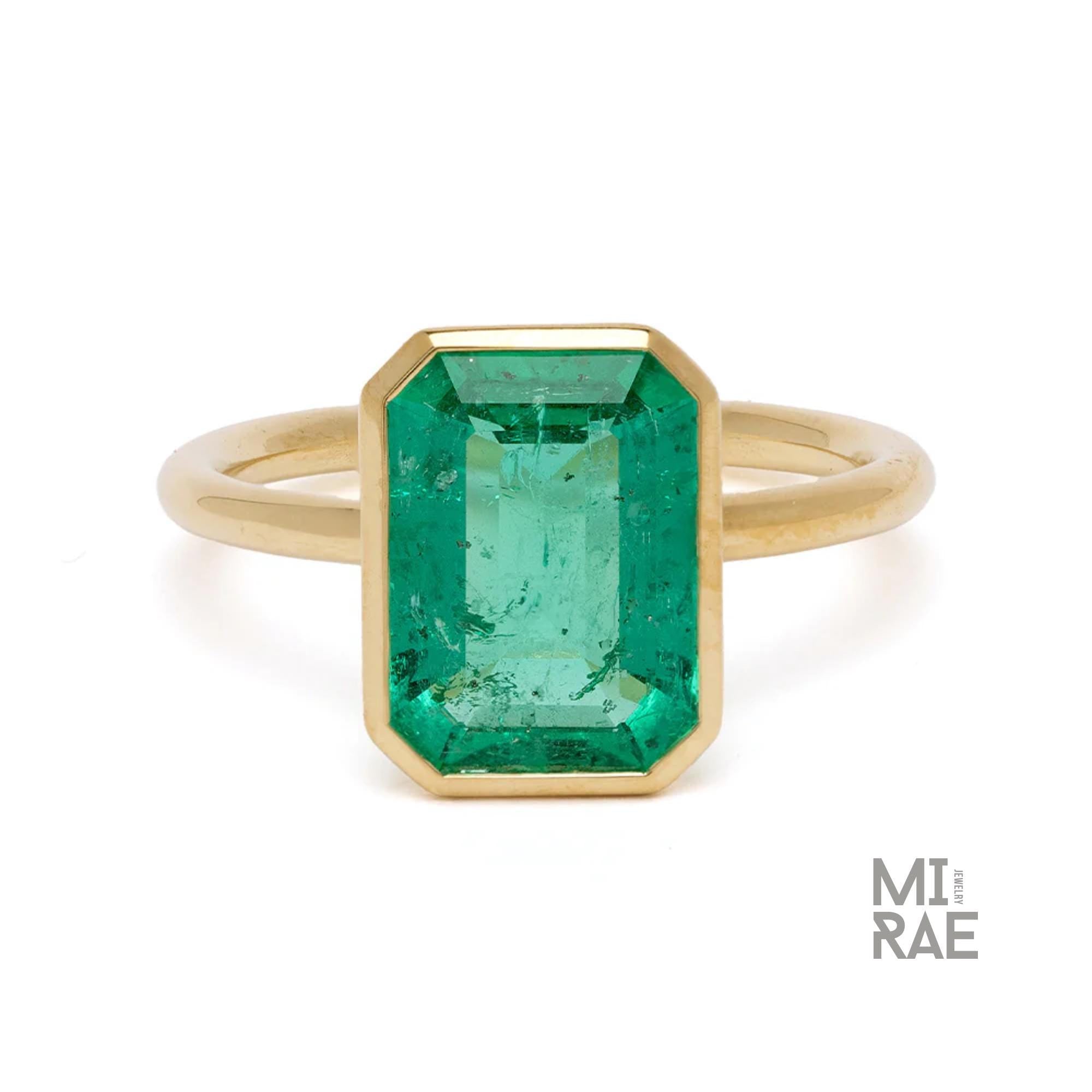 3CT Emerald Cut Emerald Ring: 18K Yellow Gold Bezel Solitaire
