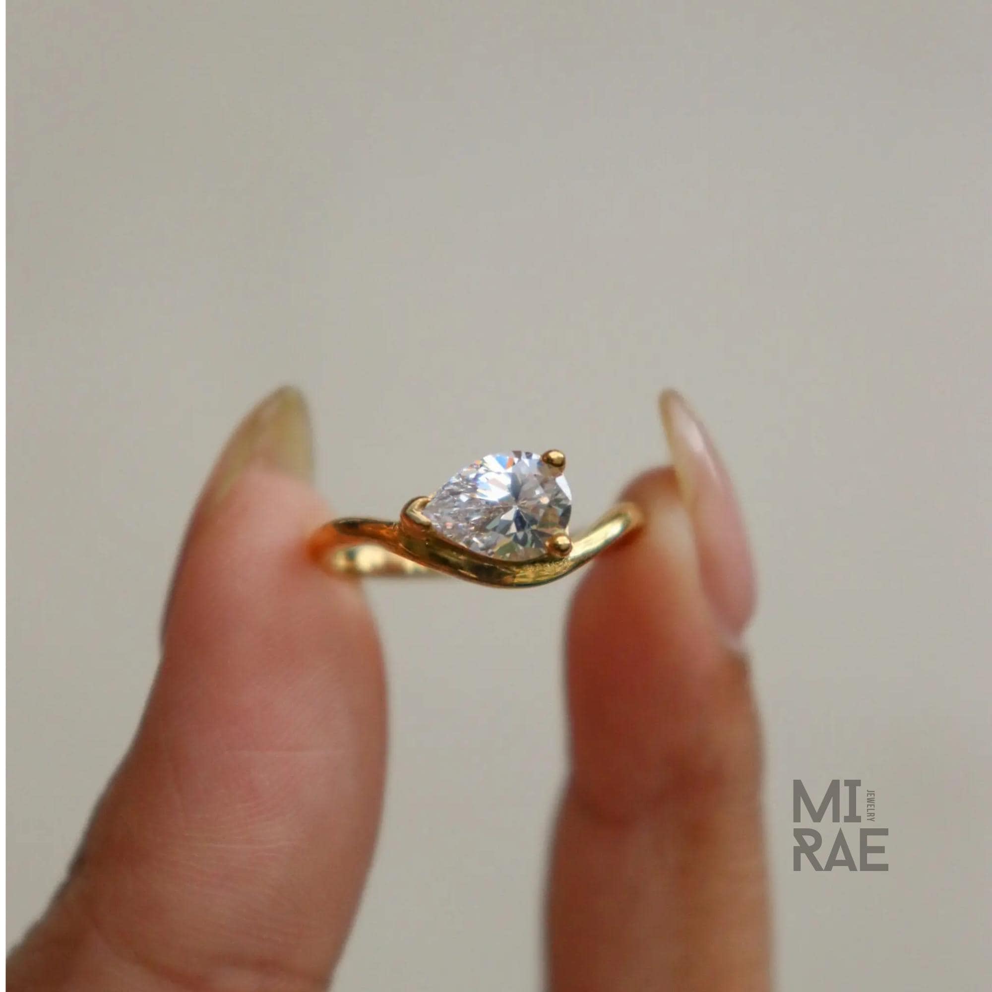 2 Carat Pear Moissanite East-West Ring: Wavy Band, Sterling Silver or Gold