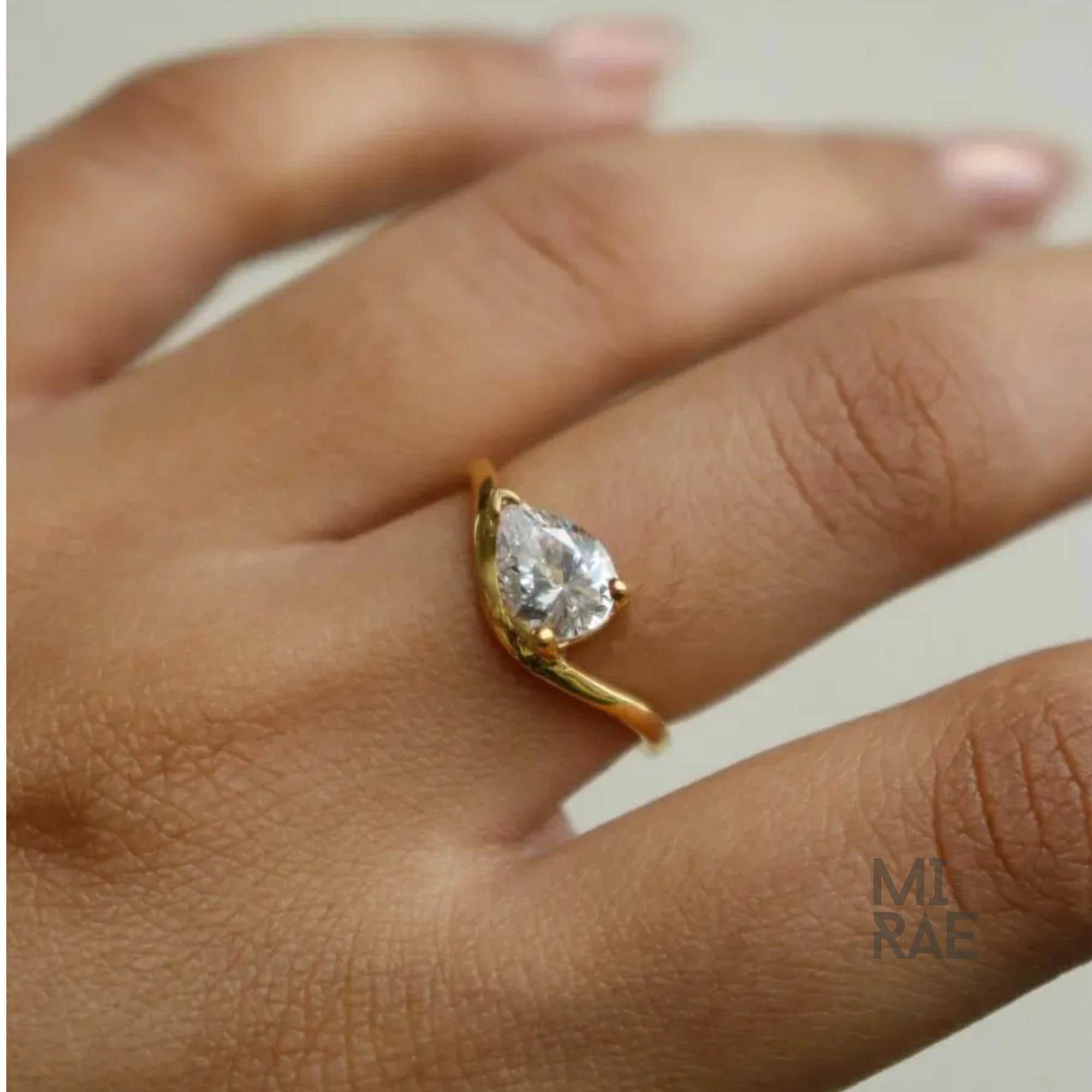 2 Carat Pear Moissanite East-West Ring: Wavy Band, Sterling Silver or Gold