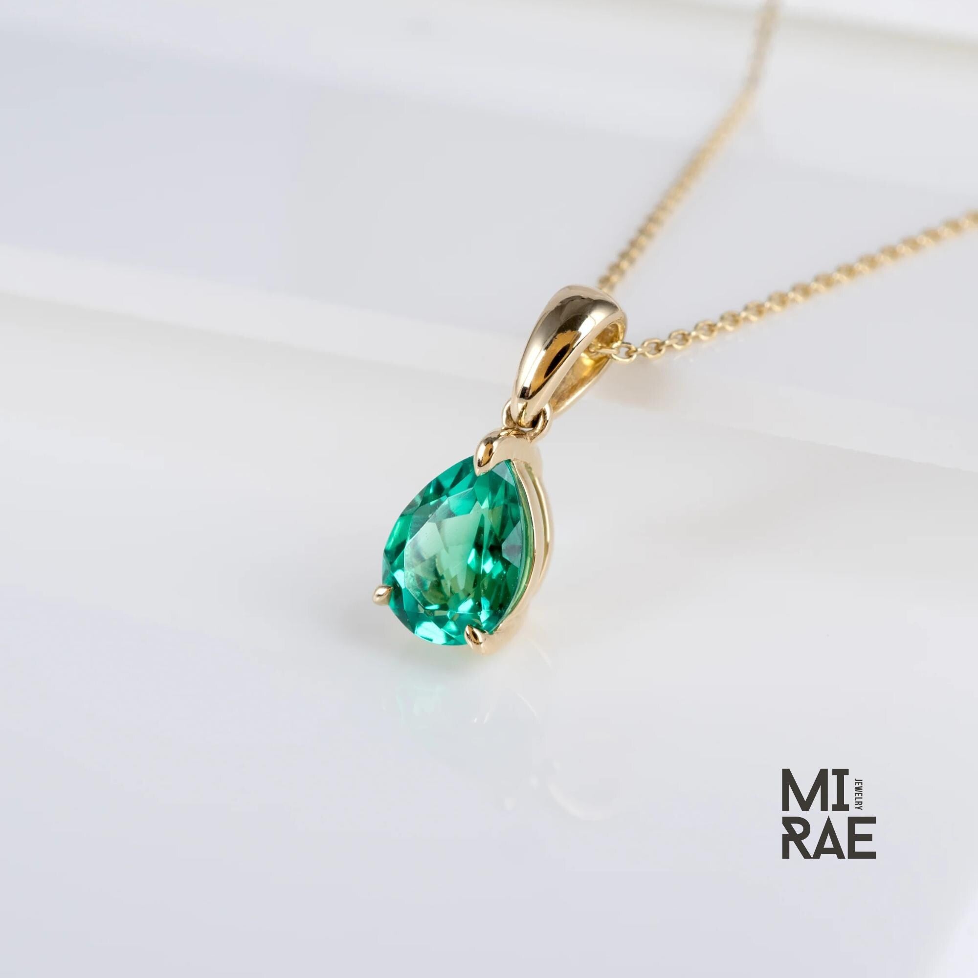 10K Gold Pear Cut Birthstone Pendant: Sapphire, Ruby, Emerald