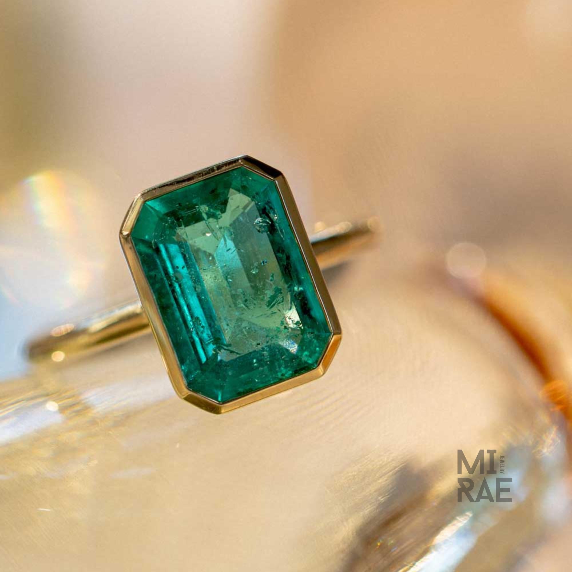 3CT Emerald Cut Emerald Ring: 18K Yellow Gold Bezel Solitaire