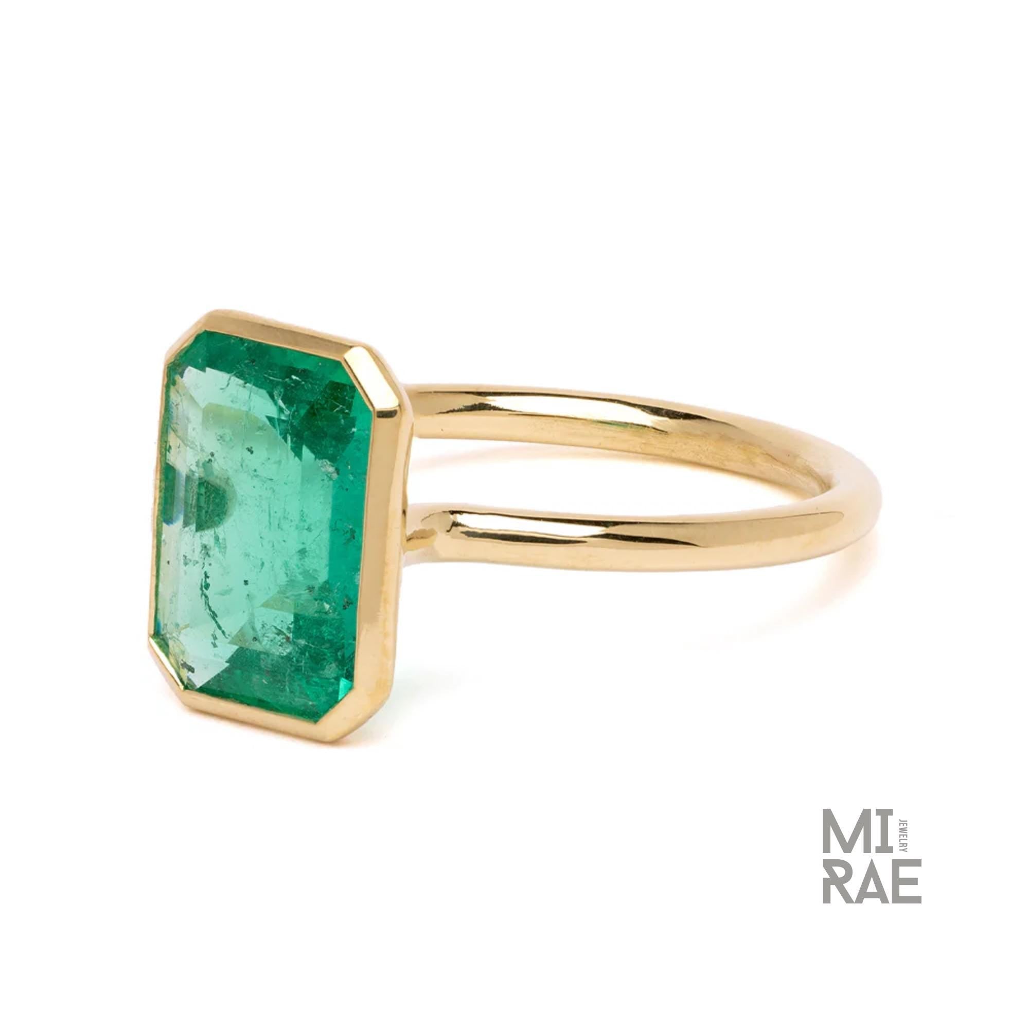 3CT Emerald Cut Emerald Ring: 18K Yellow Gold Bezel Solitaire