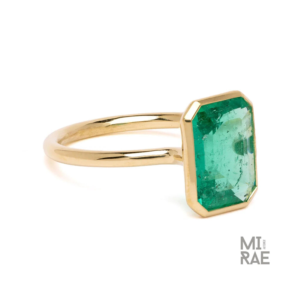 3CT Emerald Cut Emerald Ring: 18K Yellow Gold Bezel Solitaire