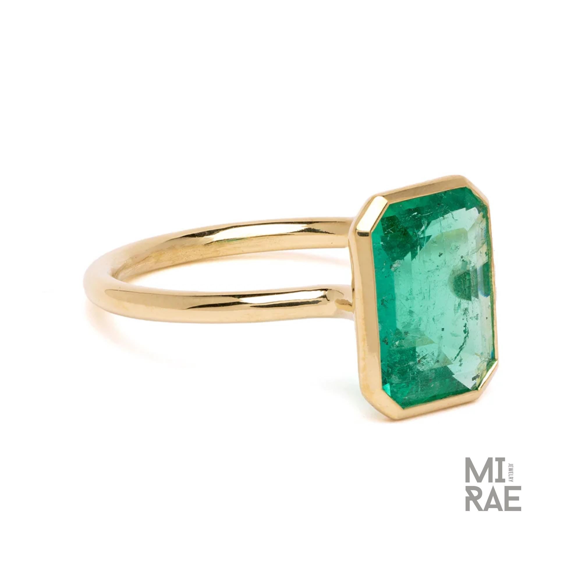 3CT Emerald Cut Emerald Ring: 18K Yellow Gold Bezel Solitaire