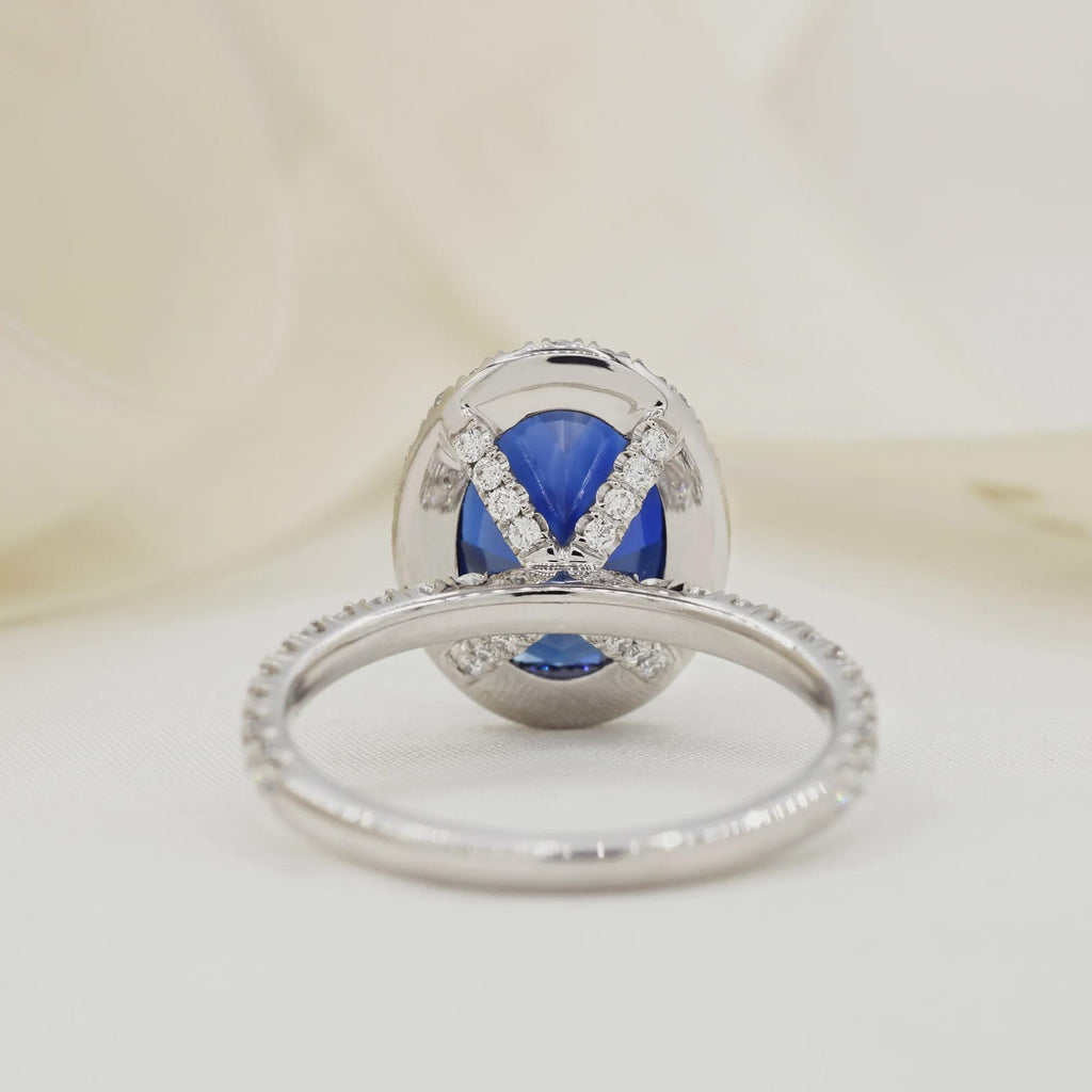 Oval Blue Sapphire Engagement Ring: 18K White Gold Halo, Moissanite Accents