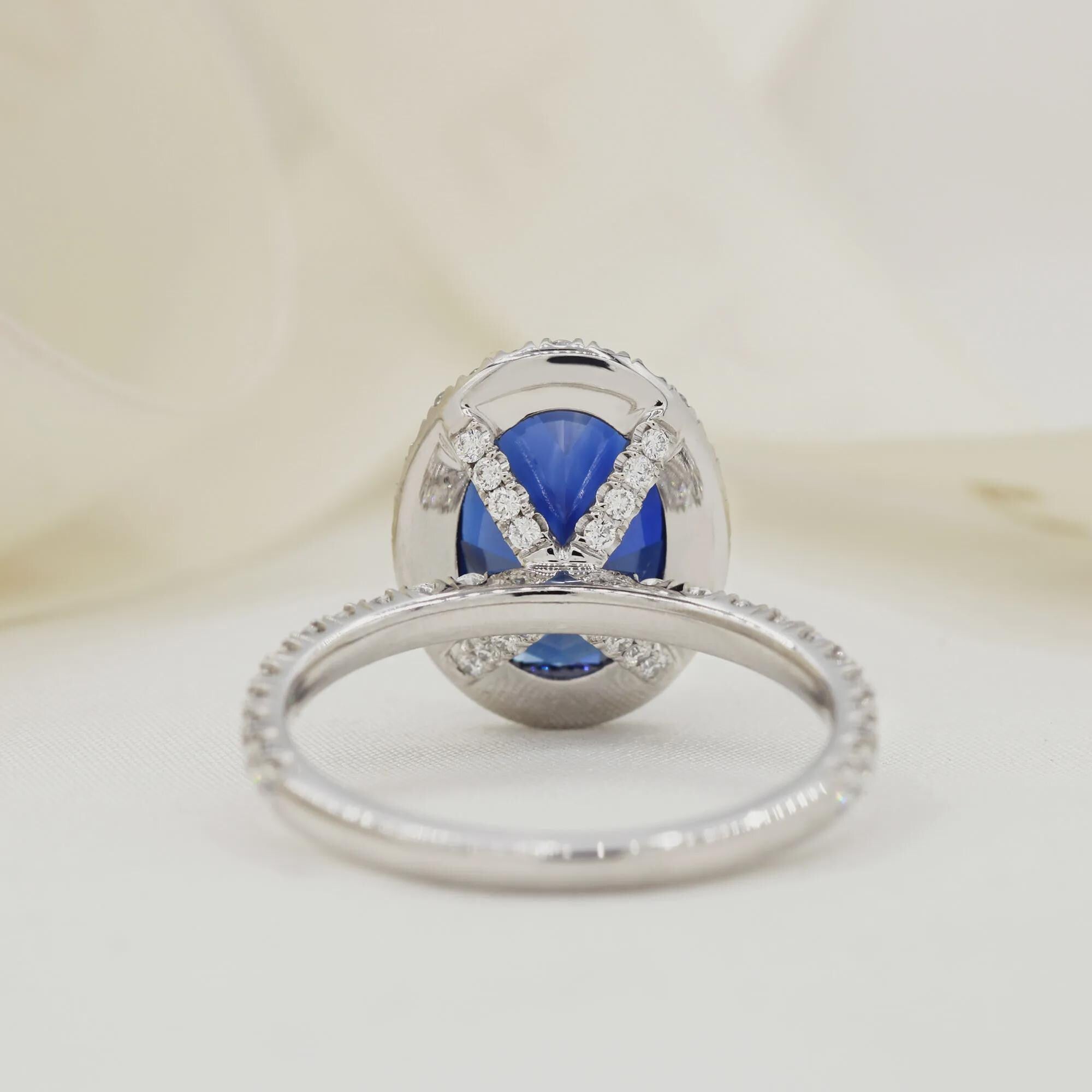 Oval Blue Sapphire Engagement Ring: 18K White Gold Halo, Moissanite Accents