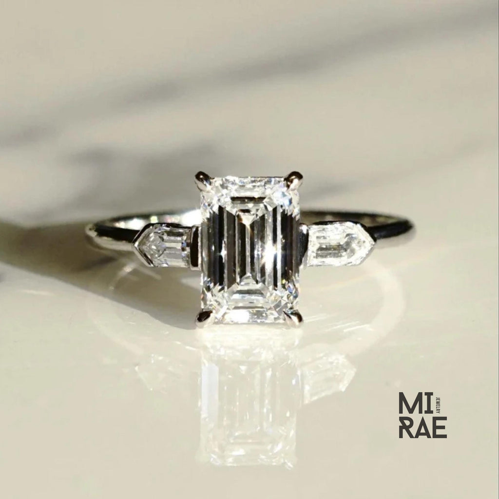 Emerald Cut Moissanite Three Stone Ring: 18K White Gold & Baguette Accents