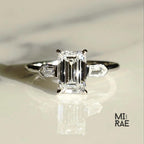 Emerald Cut Moissanite Three Stone Ring: 18K White Gold & Baguette Accents
