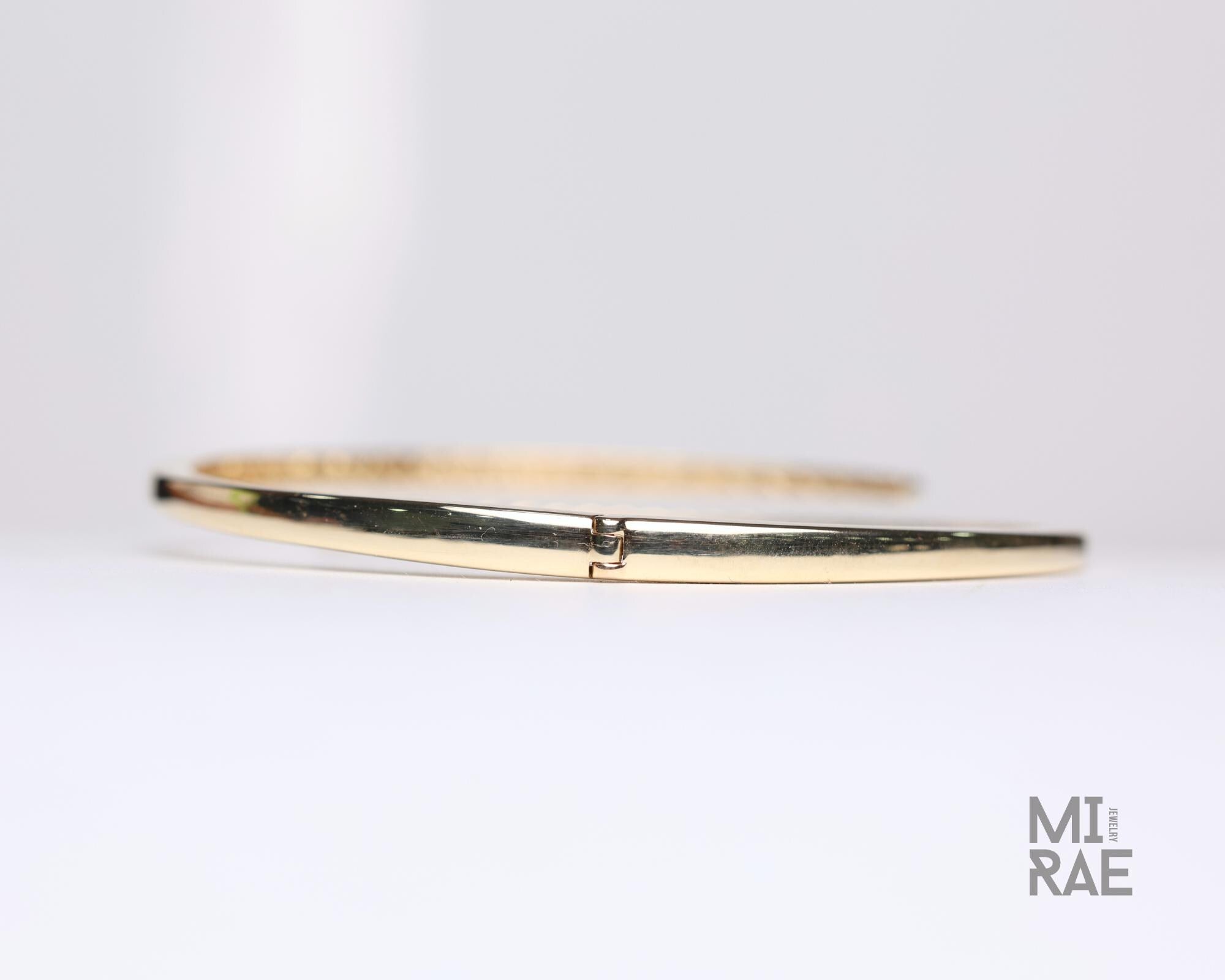 14K Gold Diamond Bangle Bracelet: 1ct Graduated Crossover Design
