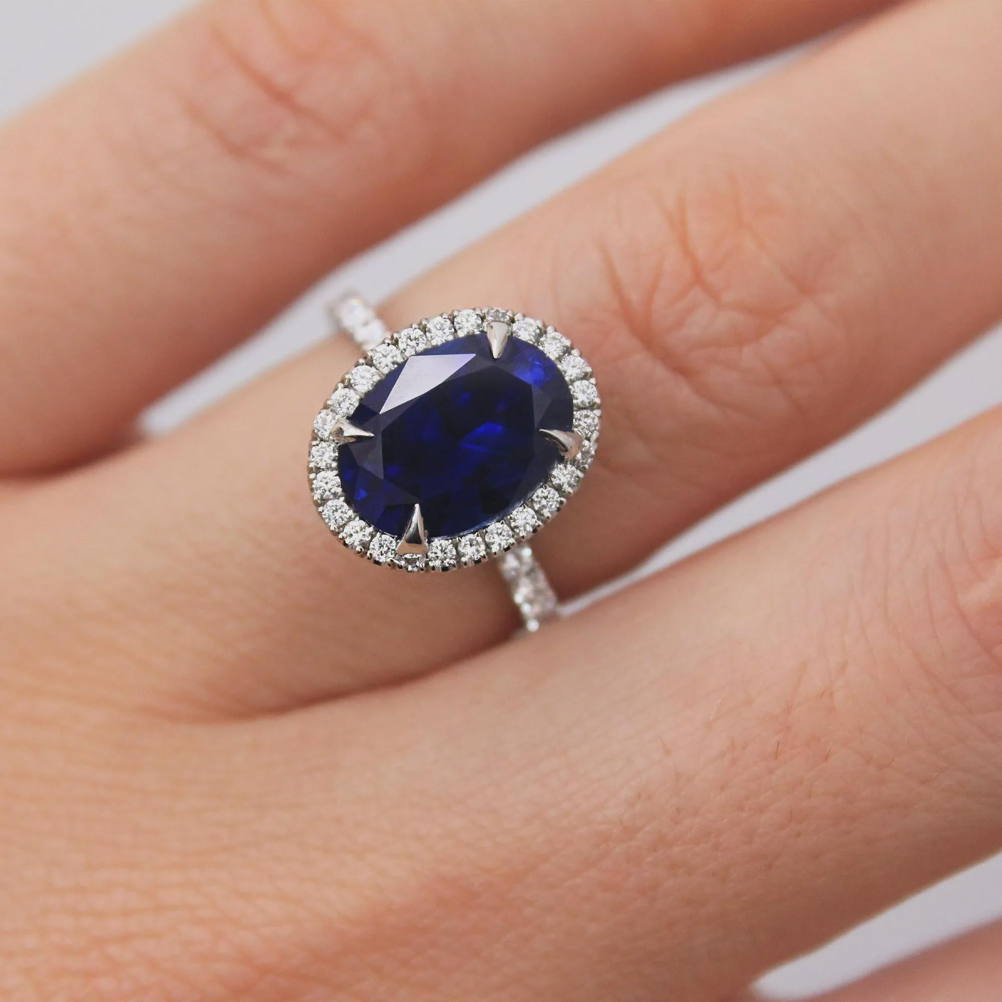 Oval Blue Sapphire Engagement Ring: 18K White Gold Halo, Moissanite Accents