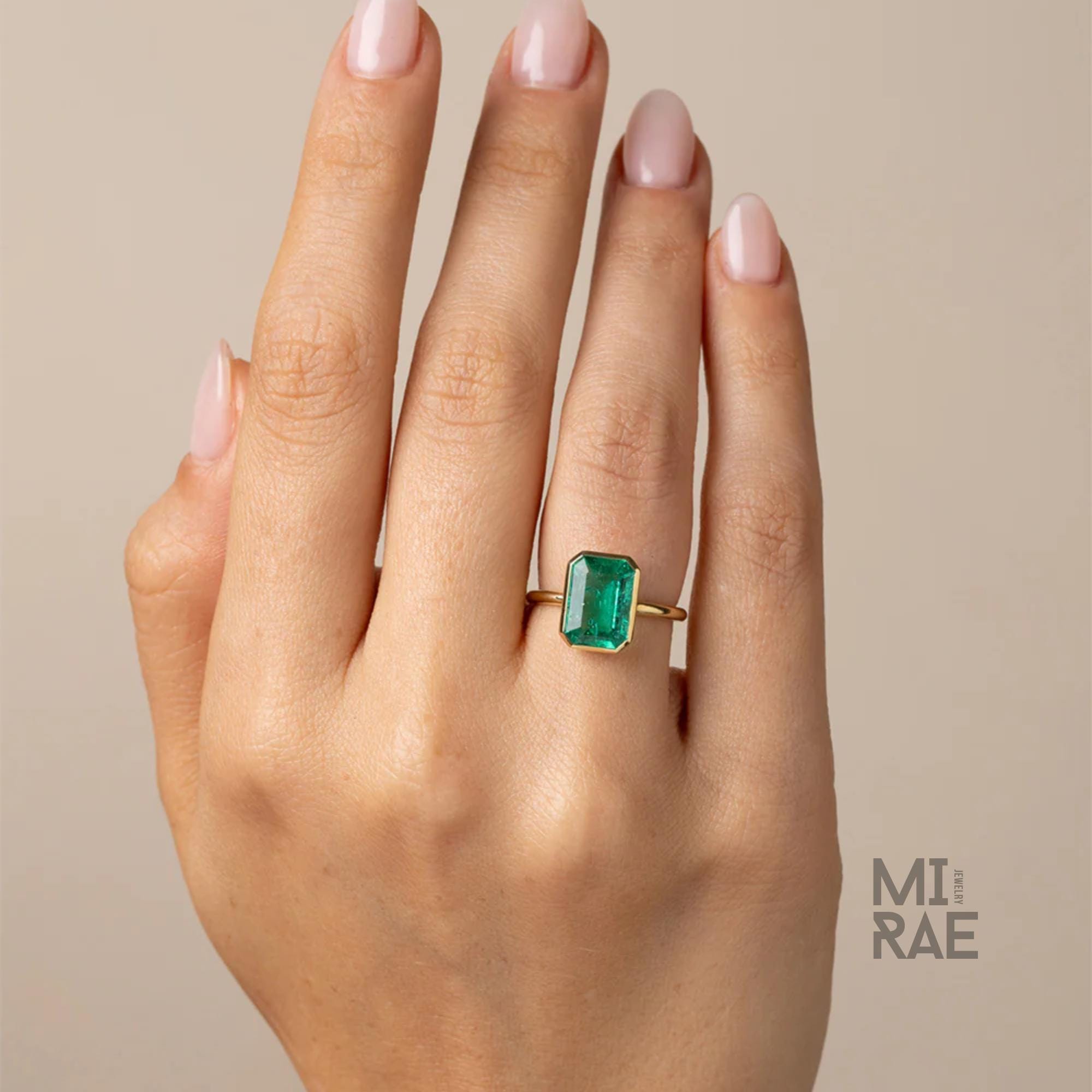 3CT Emerald Cut Emerald Ring: 18K Yellow Gold Bezel Solitaire
