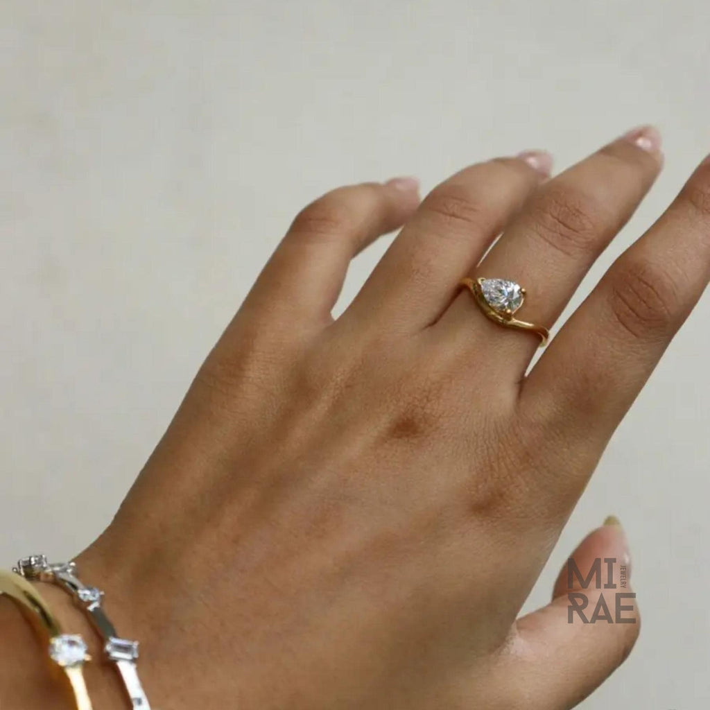 2 Carat Pear Moissanite East-West Ring: Wavy Band, Sterling Silver or Gold