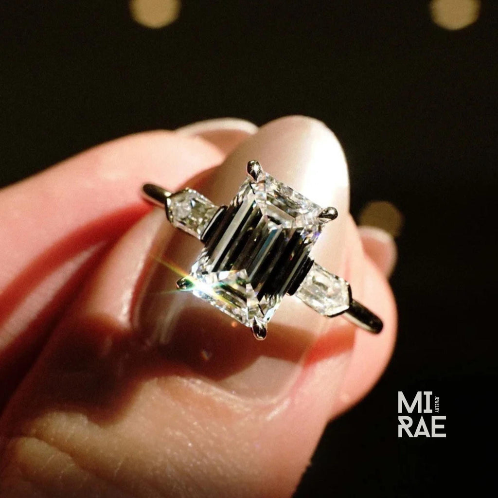 Emerald Cut Moissanite Three Stone Ring: 18K White Gold & Baguette Accents
