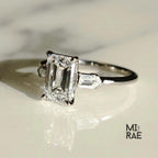 Emerald Cut Moissanite Three Stone Ring: 18K White Gold & Baguette Accents
