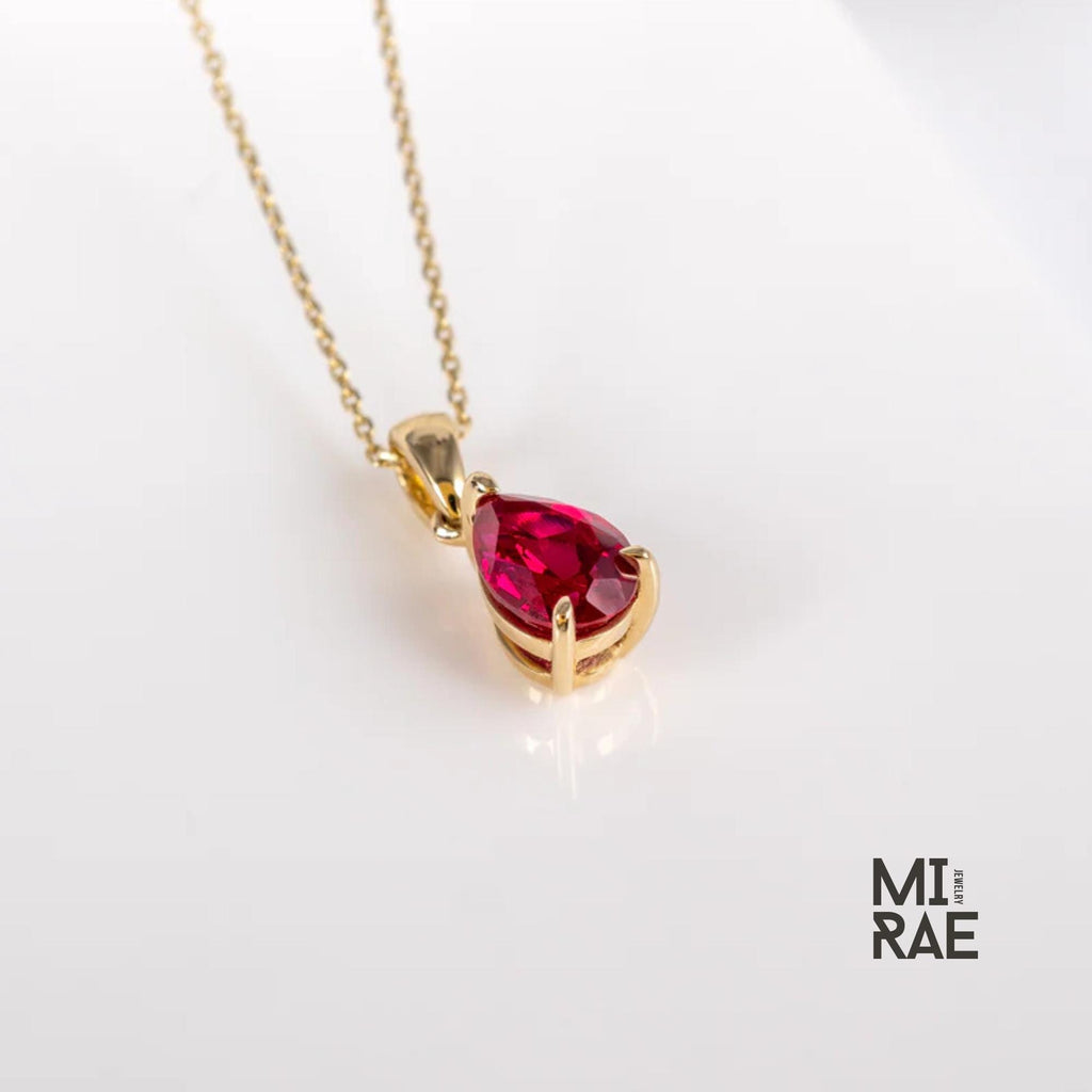 10K Gold Pear Cut Birthstone Pendant: Sapphire, Ruby, Emerald