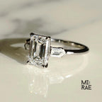 Emerald Cut Moissanite Three Stone Ring: 18K White Gold & Baguette Accents